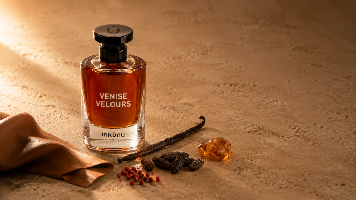 Niche amber perfume bottle on warm stone with vanilla and tonka, INKÛNU