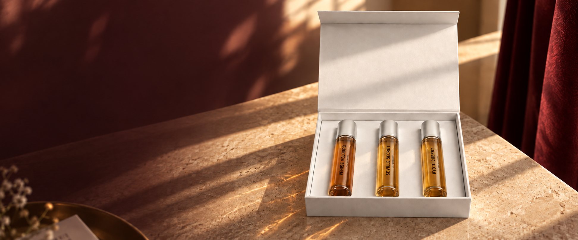 The INKÛNU Travel Set on a stone table in golden hour light
